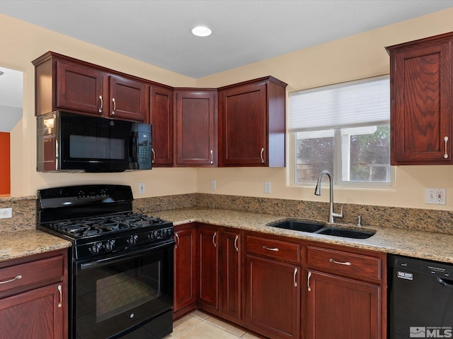 1820 Bogie Ct, Fernley, NV 89408 - kitchen featuring black appliances, a sink, dark brown cabinets, and light stone countertops