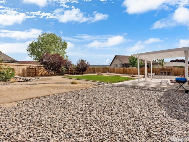 1820 Bogie Ct, Fernley, NV 89408 - fenced backyard with a patio and a pergola