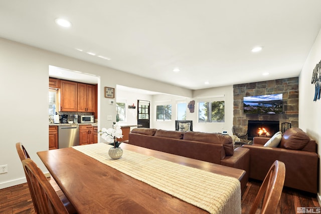 758 Milky Way Ct Unit E, Stateline, NV 89449 - dining room featuring dark wood-style flooring, recessed lighting, a stone fireplace, and baseboards