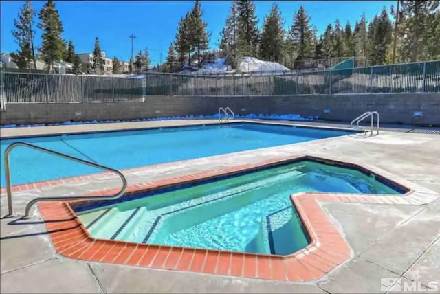 758 Milky Way Ct Unit E, Stateline, NV 89449 - community pool featuring a hot tub, fence, and a patio area
