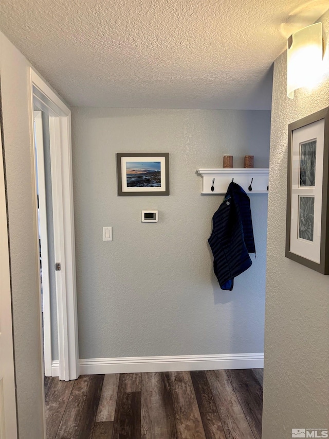 2855 Idlewild Dr Apt 124, Reno, NV 89509 - mudroom featuring wood finished floors, a textured ceiling, and baseboards