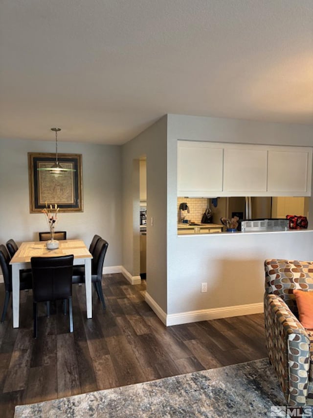 2855 Idlewild Dr Apt 124, Reno, NV 89509 - dining space with dark wood-style floors and baseboards