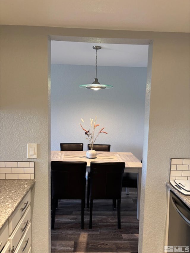 2855 Idlewild Dr Apt 124, Reno, NV 89509 - dining room featuring dark wood finished floors and a textured wall