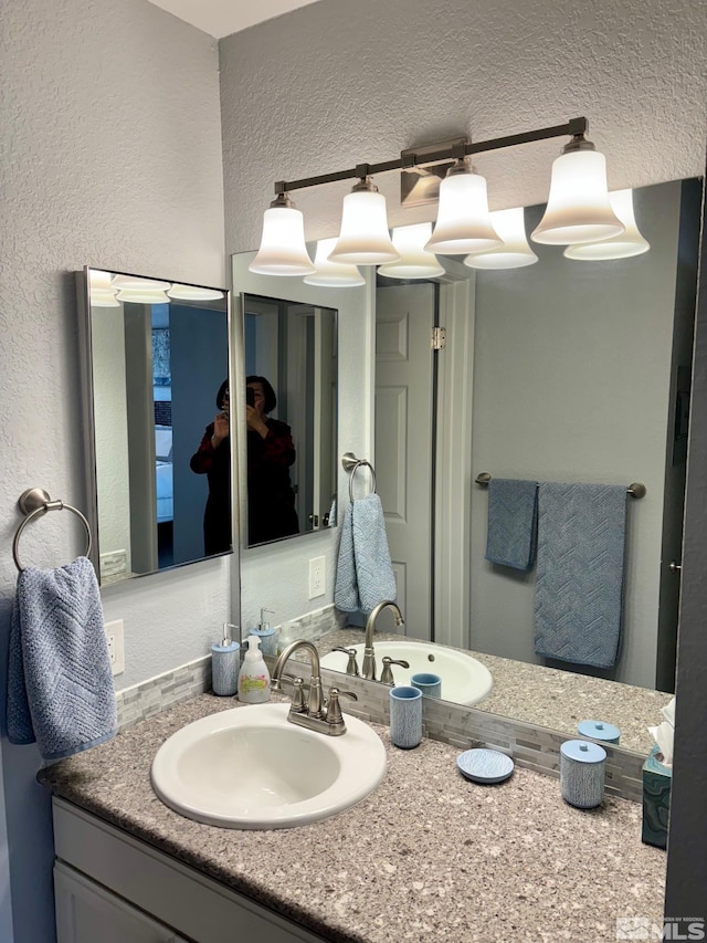 2855 Idlewild Dr Apt 124, Reno, NV 89509 - bathroom with vanity and a textured wall
