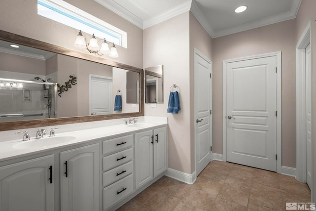 full bathroom featuring an enclosed shower, crown molding, double vanity, and baseboards