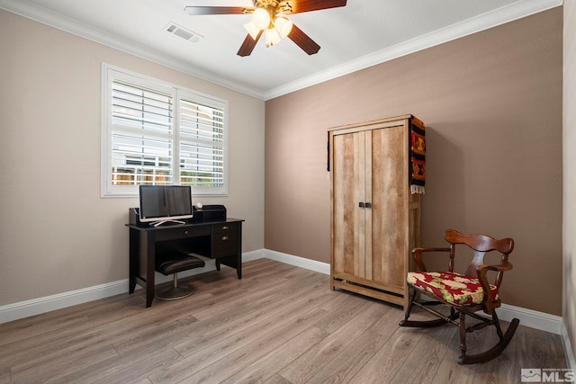 home office featuring light wood finished floors, ceiling fan, ornamental molding, and baseboards
