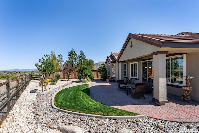 fenced backyard featuring a patio