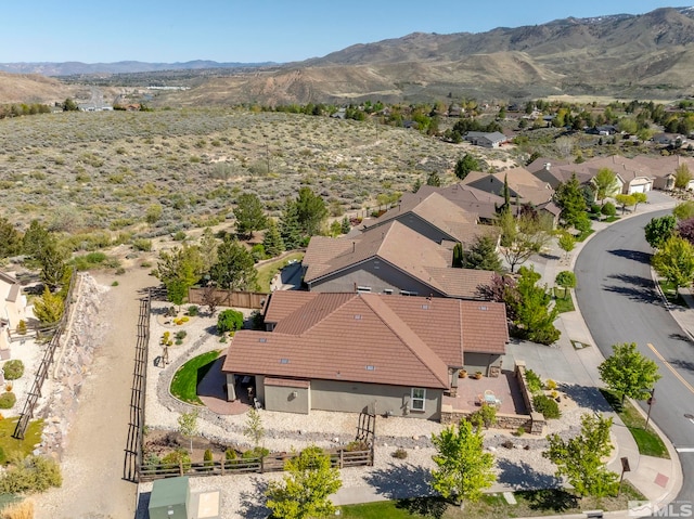 aerial view of property and surrounding area with a mountainous background
