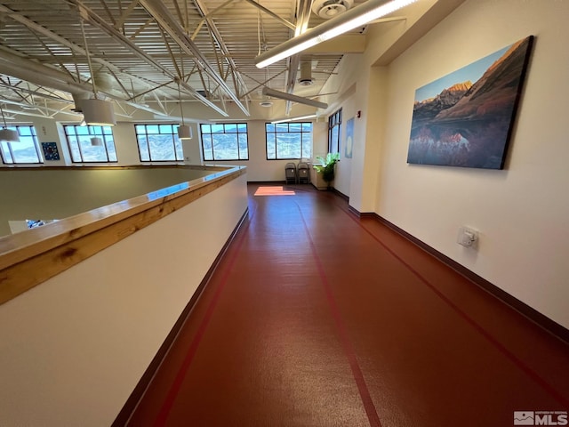 corridor featuring baseboards