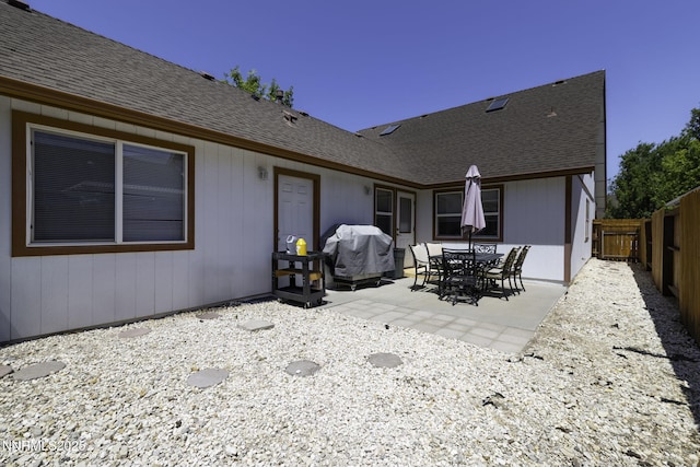1419 Honey Locust, Gardnerville, NV 89410 - rear view of property with a patio area, a fenced backyard, and a shingled roof