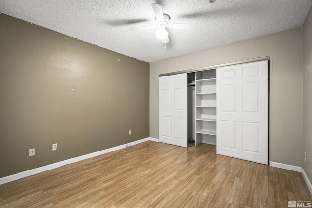 4941 Reggie Rd, Reno, NV 89502 - unfurnished bedroom with a textured ceiling, light wood-style floors, baseboards, a closet, and ceiling fan