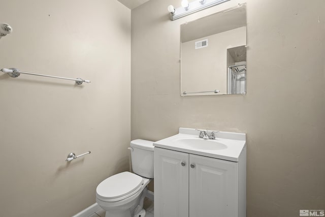 4941 Reggie Rd, Reno, NV 89502 - bathroom with toilet, vanity, and baseboards