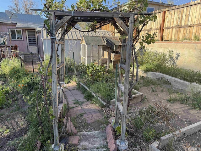 1702 Grandview Ave, Reno, NV 89503 - view of yard featuring fence and a garden