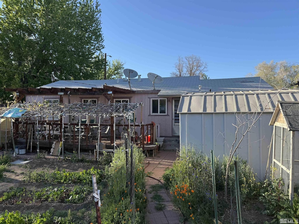 1702 Grandview Ave, Reno, NV 89503 - rear view of house with a storage shed, an outdoor structure, and a wooden deck