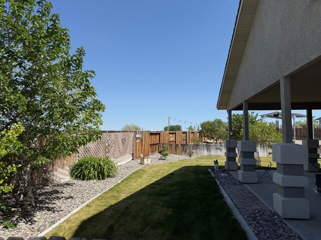921 Red Rock Rd, Fernley, NV 89408 - fenced backyard featuring a patio area
