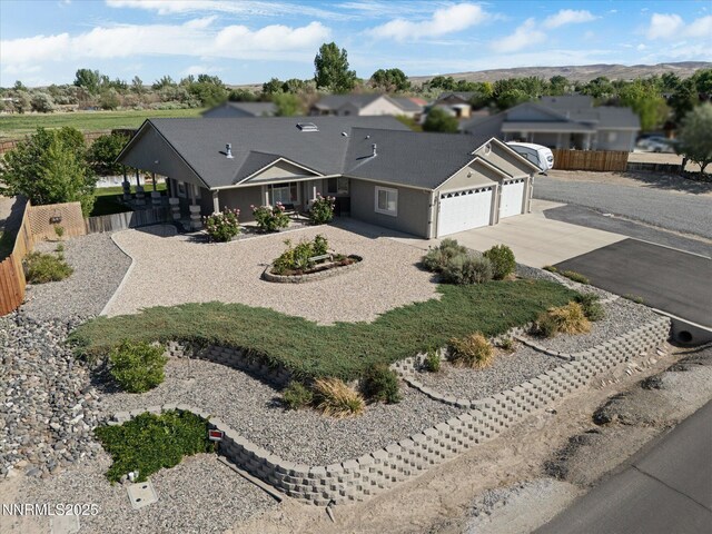 921 Red Rock Rd, Fernley, NV 89408 - view of front of home with a garage, concrete driveway, and a residential view