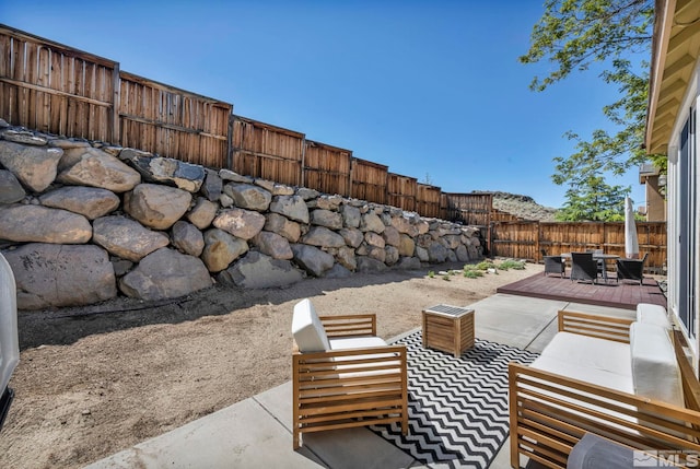 5132 Ironstone Cir, Sparks, NV 89436 - view of patio with a fenced backyard, an outdoor hangout area, and a wooden deck