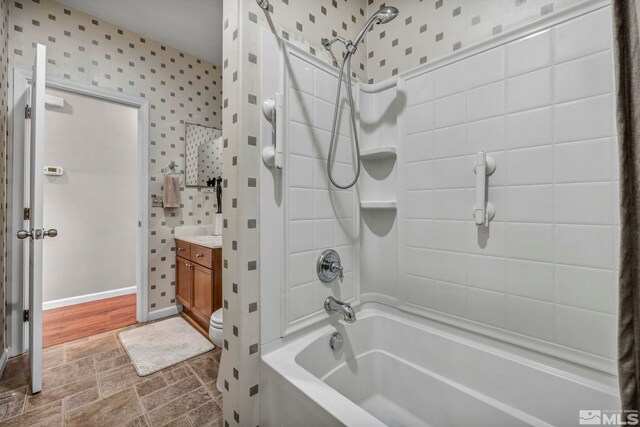 5132 Ironstone Cir, Sparks, NV 89436 - bathroom with wallpapered walls, bathtub / shower combination, vanity, and baseboards