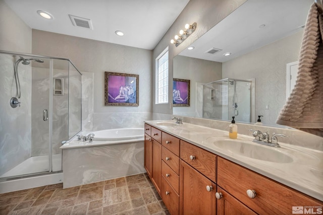 5132 Ironstone Cir, Sparks, NV 89436 - full bath featuring a shower stall, a garden tub, double vanity, stone finish floors, and recessed lighting