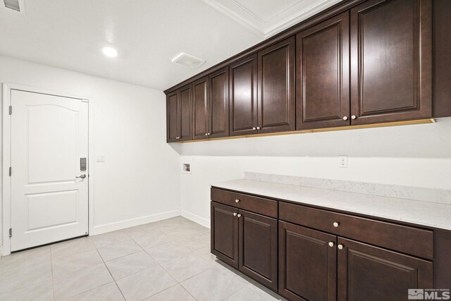 1132 Alder Walk Way, Sparks, NV 89441 - washroom featuring cabinet space, washer hookup, baseboards, light tile patterned floors, and crown molding
