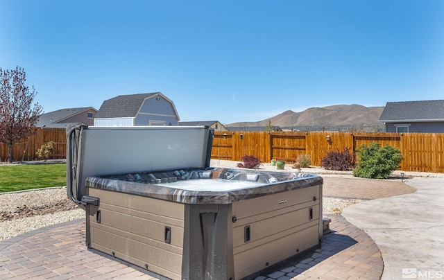 1132 Alder Walk Way, Sparks, NV 89441 - view of patio with a hot tub, a fenced backyard, and a mountain view