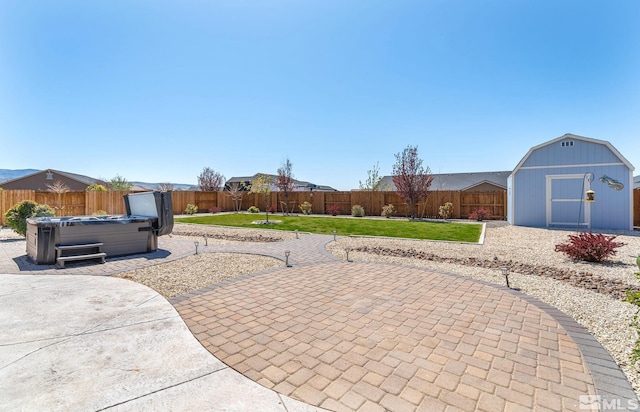 1132 Alder Walk Way, Sparks, NV 89441 - view of patio / terrace with a hot tub, a shed, and an outbuilding