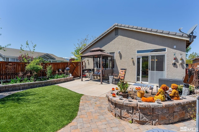 1717 Burwood Cir, Reno, NV 89521 - rear view of property with a patio, a gazebo, and stucco siding