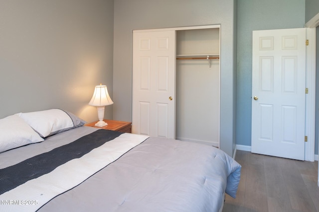 2765 Erin Dr, Sparks, NV 89436 - bedroom featuring wood finished floors, a closet, and baseboards