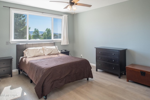 2765 Erin Dr, Sparks, NV 89436 - bedroom featuring light wood-style floors, baseboards, and a ceiling fan