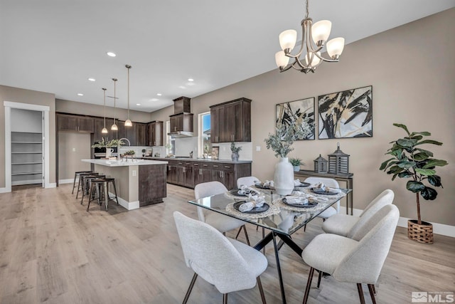 698 Sage Grouse Lp, Gardnerville, NV 89460 - dining space featuring light wood-type flooring, a chandelier, baseboards, and recessed lighting