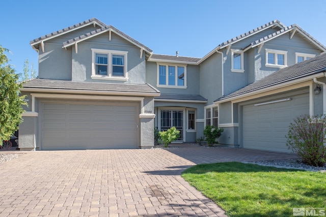 1304 Lambrusca Dr, Sparks, NV 89436 - view of front of home with decorative driveway, a tile roof, and an attached garage