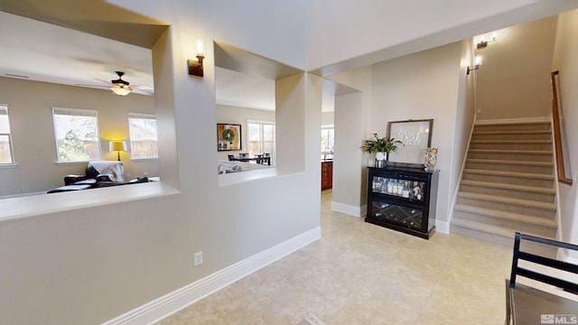 1304 Lambrusca Dr, Sparks, NV 89436 - hallway featuring healthy amount of natural light, stairway, baseboards, and tile patterned floors