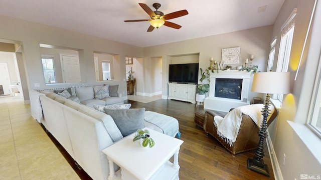 1304 Lambrusca Dr, Sparks, NV 89436 - living area featuring ceiling fan, a glass covered fireplace, and baseboards