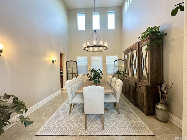 1304 Lambrusca Dr, Sparks, NV 89436 - dining room featuring a chandelier, a towering ceiling, and baseboards