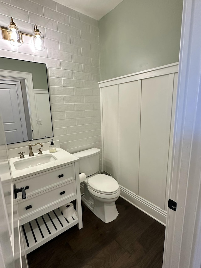 1304 Lambrusca Dr, Sparks, NV 89436 - half bathroom with wood finished floors, toilet, vanity, a decorative wall, and wainscoting
