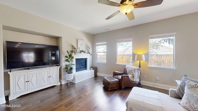 1304 Lambrusca Dr, Sparks, NV 89436 - living room featuring dark wood-type flooring, a glass covered fireplace, and a ceiling fan