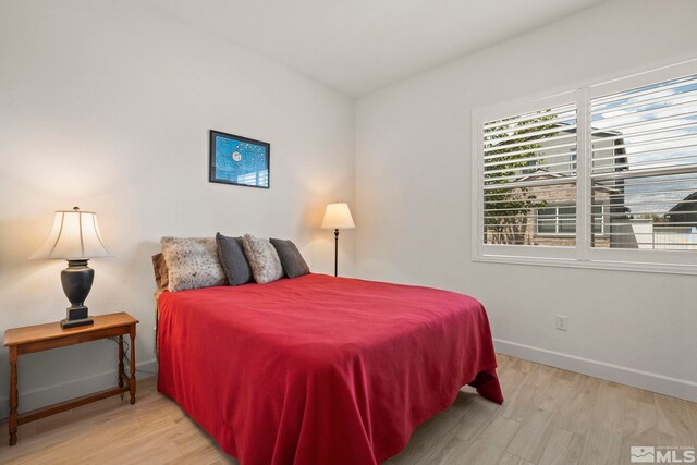 606 Braided Rope Dr, Reno, NV 89511 - bedroom featuring baseboards and wood finished floors