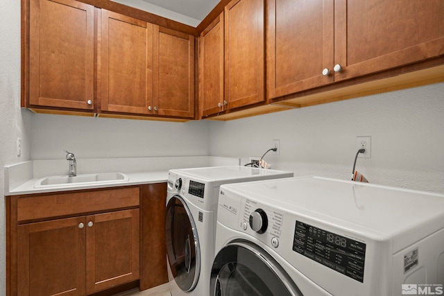 606 Braided Rope Dr, Reno, NV 89511 - laundry room featuring independent washer and dryer and cabinet space