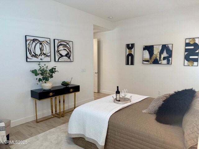 606 Braided Rope Dr, Reno, NV 89511 - bedroom featuring light wood-style flooring and baseboards