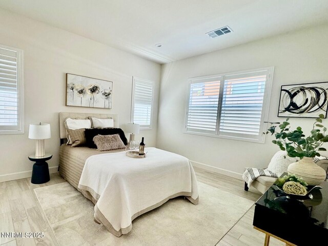 606 Braided Rope Dr, Reno, NV 89511 - bedroom featuring light wood-style floors and baseboards