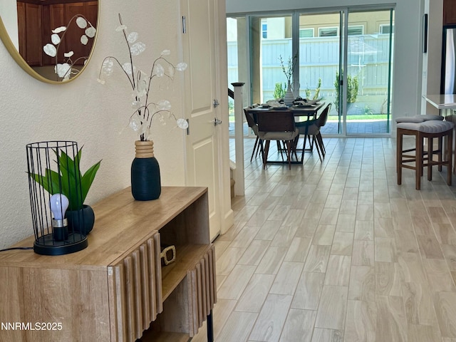 606 Braided Rope Dr, Reno, NV 89511 - hall with a textured wall, plenty of natural light, and light wood-style flooring