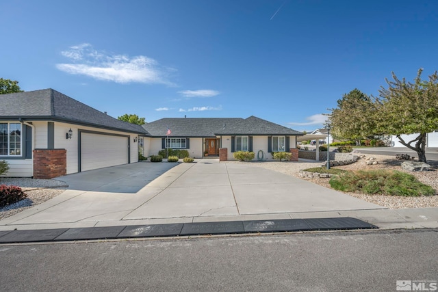 1871 Walnut Ct, Carson City, NV 89703 - single story home featuring an attached garage, concrete driveway, brick siding, and a shingled roof