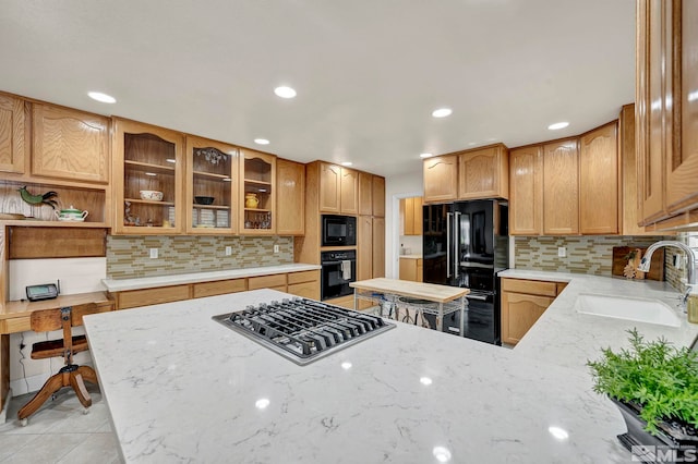 1871 Walnut Ct, Carson City, NV 89703 - kitchen featuring black appliances, a sink, decorative backsplash, light stone countertops, and recessed lighting