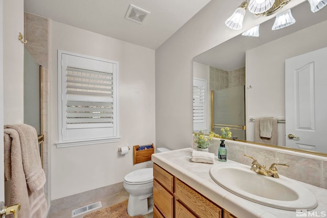 1871 Walnut Ct, Carson City, NV 89703 - full bathroom with a stall shower, vanity, toilet, tile patterned flooring, and baseboards