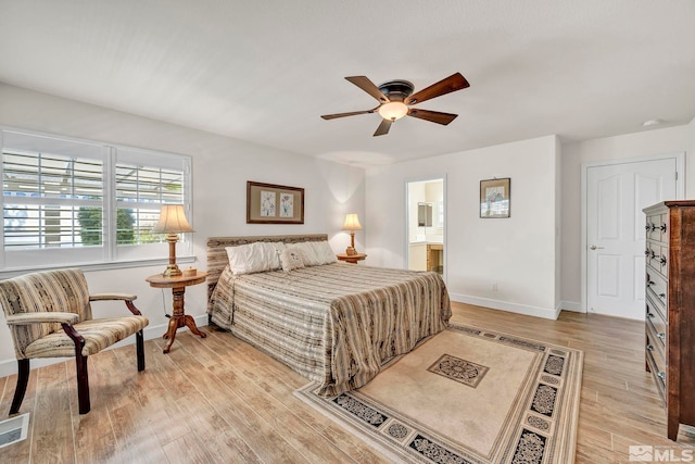 1871 Walnut Ct, Carson City, NV 89703 - bedroom featuring light wood-style floors, baseboards, a ceiling fan, and ensuite bathroom