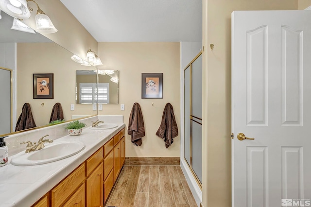 1871 Walnut Ct, Carson City, NV 89703 - full bathroom with a shower stall, double vanity, and wood finished floors