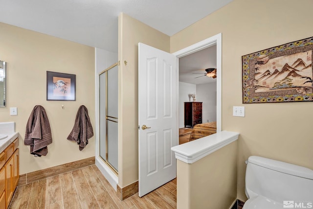 1871 Walnut Ct, Carson City, NV 89703 - full bath with vanity, a shower stall, wood finished floors, and toilet