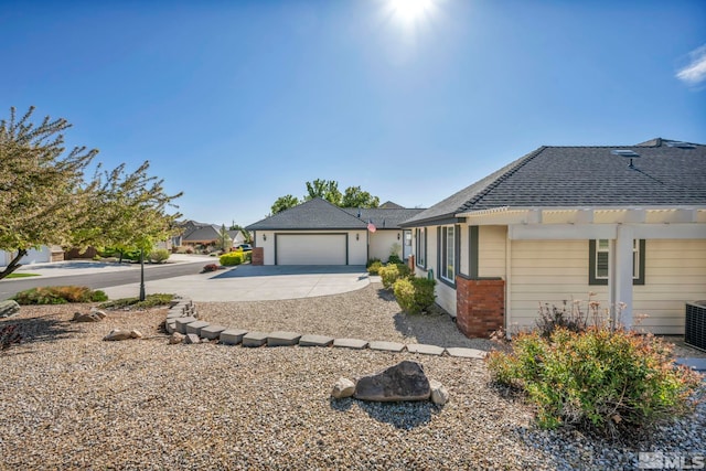 1871 Walnut Ct, Carson City, NV 89703 - single story home with concrete driveway, brick siding, a shingled roof, and a pergola