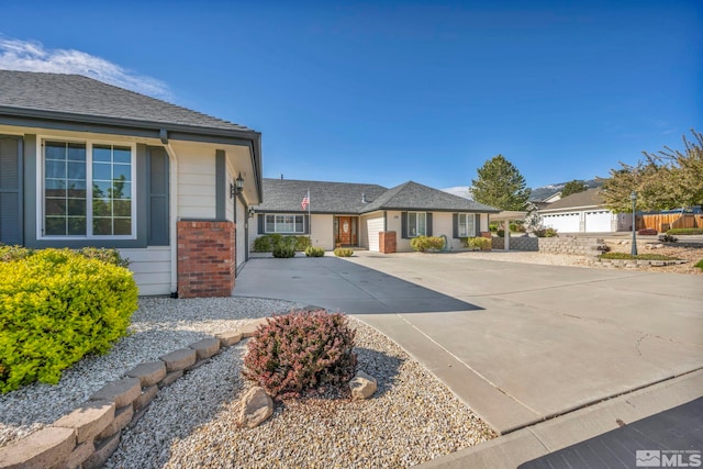 1871 Walnut Ct, Carson City, NV 89703 - view of front facade with concrete driveway and brick siding