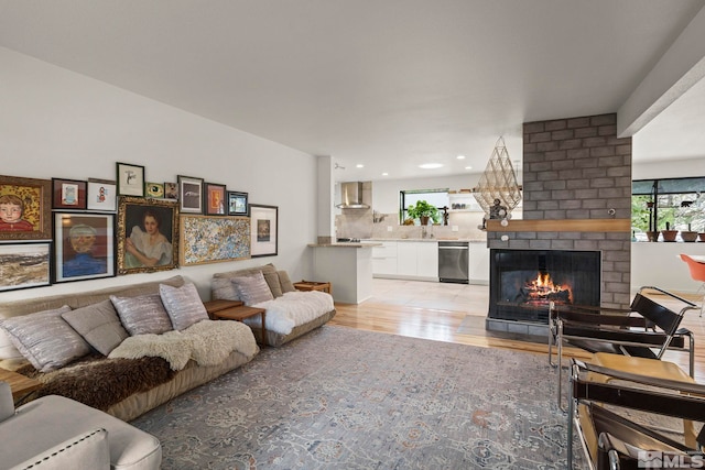 3255 Corey Dr, Reno, NV 89509 - living area with light wood-style flooring, healthy amount of natural light, a brick fireplace, and recessed lighting
